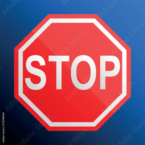 The red stop sign isolated on a blue background.