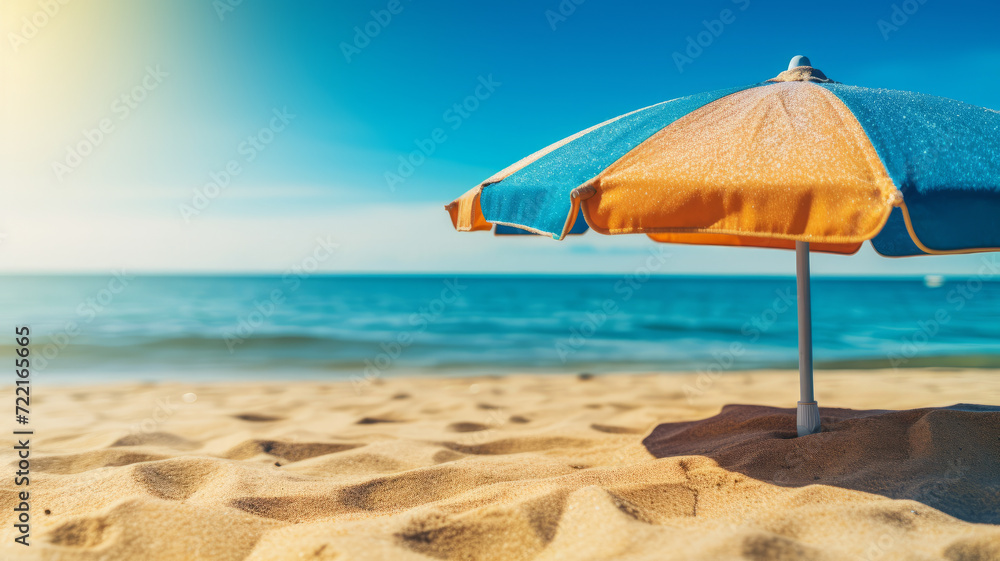 A colorful cocktail on a beach towel radiates carefree summer vibes under the golden sun.