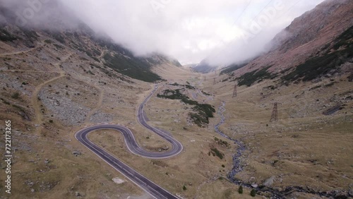Curvy mountain road with lake at top