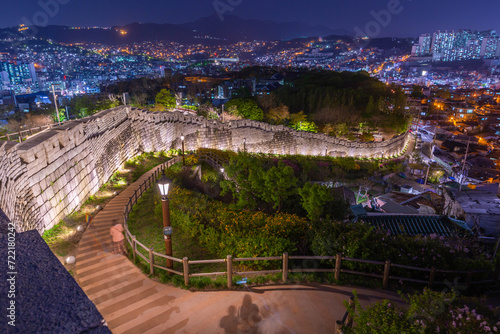 Korean cityscape at night at Naksan Park with Ancient Walls in Seoul, South Korea.
