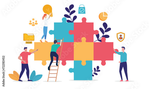 Group of individuals working together to assemble a jigsaw puzzle, symbolizing teamwork and collaboration