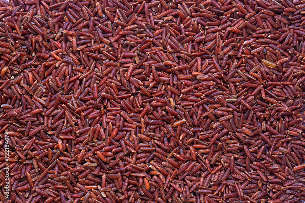 Fototapeta premium Macro black rice seeds,Close up background view of organic black purple rice.