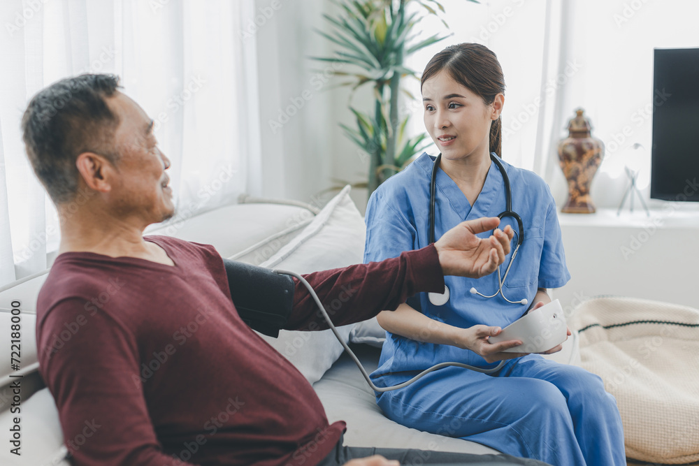 custom made wallpaper toronto digitalCaregiver nurse measuring blood pressure by using digital sphygmomanometer Senior patient at home. Caregiver nurse using medical device to measure blood pressure Senior patient