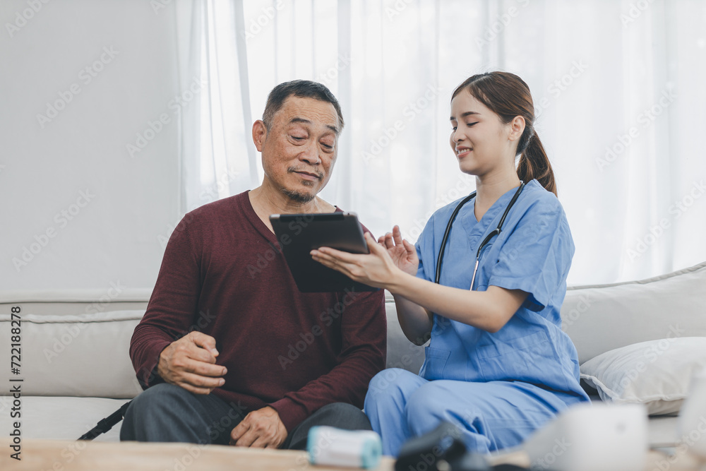 Nurse assisting her old patient at nursing home. Caregiver helping senior patient sit on sofa. Friendly female nurse talking with patient at nursing home Nurse assisting her old patient at nursing home. Caregiver helping senior patient sit on sofa. Friendly female nurse talking with patient at nursing home