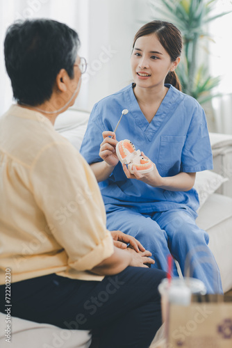 Woman dentist in dental office talking with Senior female patient and preparing for treatment. A dentist talking to Senior woman in dentist surgery, a dental check-up.