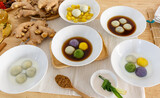 Stuffed Glutinous Rice Balls with Sesame in Sweet Ginger Soup