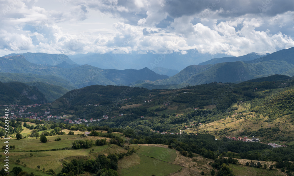Settlement in valley surrounded with mountains, countryside near Prozor in Bosnia and Herzegovina, mountain landscape