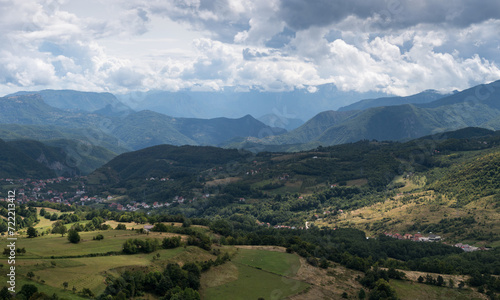 Fototapeta Naklejka Na Ścianę i Meble -  Settlement in valley surrounded with mountains, countryside near Prozor in Bosnia and Herzegovina, mountain landscape