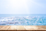 Empty wooden table with beautiful Sea on background. Empty table with defocused beach background