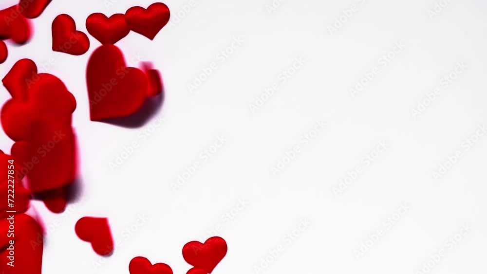 Red hearts falling on a white background. slow motion. flat lay, top view, Love, Valentine's Day February 14, Mother's Day, Wedding Red hearts falling on a white background. slow motion. flat lay, top view, Love, Valentine's Day February 14, Mother's Day, Wedding