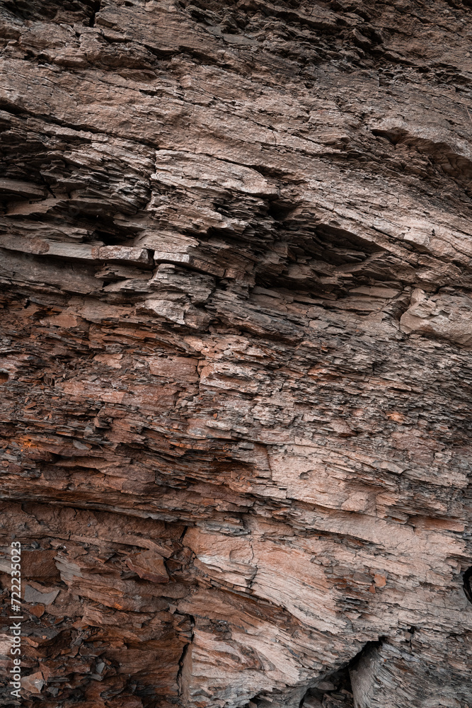 Texture natural brown stone wall vertical Texture natural brown stone wall vertical