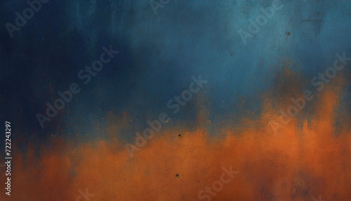 Abstract grunge texture with a dynamic clash of orange and dark blue hues and paint splatters.