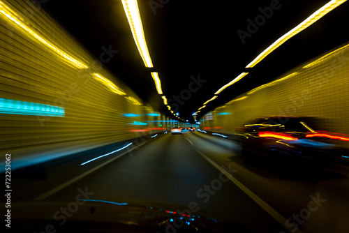 Motion. Car in tunnel. Blurred car ride. Car driving traffic. Speed riding. Car motion. Speed ride. photo