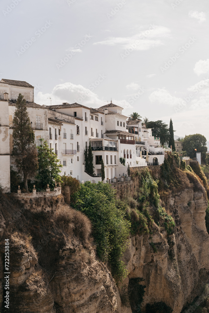 white village buildings on a cliffside in Ronda Spain