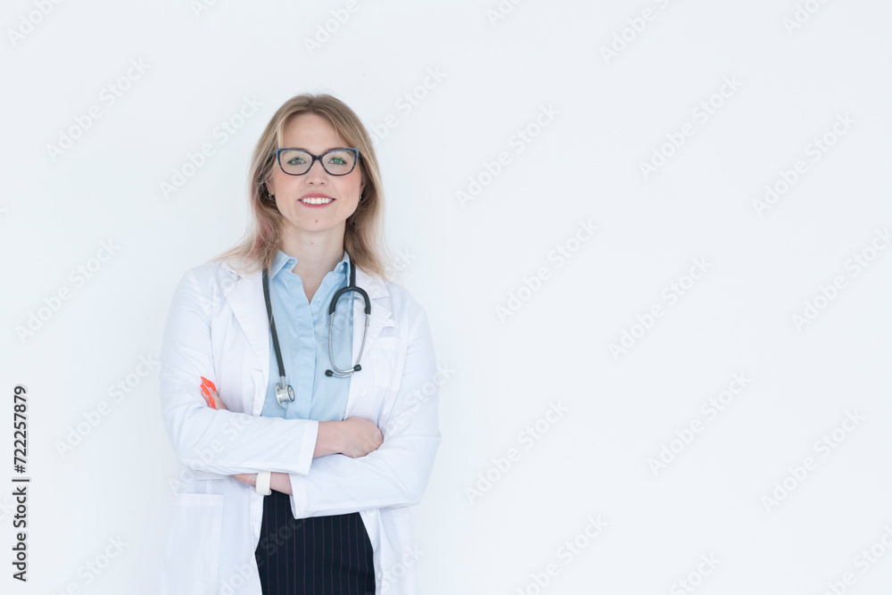 Young attractive female doctor standing with crossed arms and smiling isolated on white background Young attractive female doctor standing with crossed arms and smiling isolated on white background