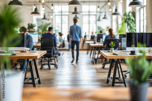 People Working in a Co-Working Space. Sitting on Computer Desks in Modern Office. Work Space Concept.
