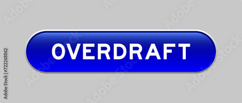 Blue color capsule shape button with word overdraft on gray background