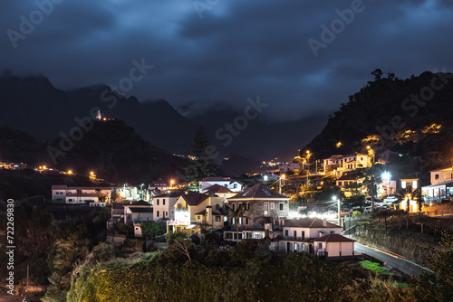 The night atmosphere and streetlights of the picturesque village on the north coast in a green, overgrown valley. Sao Vincente, Madeira Island, Portugal, Europe.