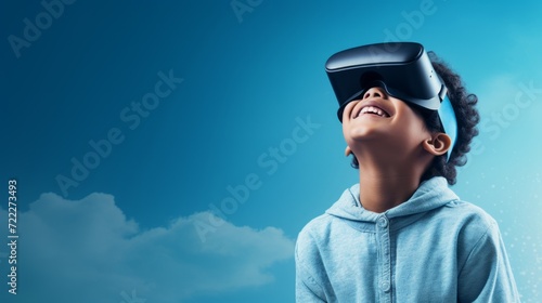 Kid using virtual reality headset on light blue background. © STKS