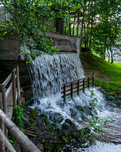 Artificial waterfall in public park.  Vecais parks, Smiltene, Latvia. photo