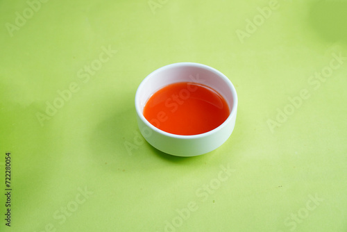 Chilli Sauce on green background