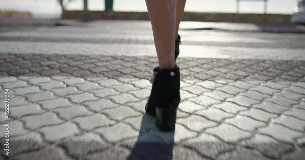Closeup, pedestrian and woman with high heels, walking and morning with sunshine, road and formal. Person, employee and worker on the street, moving and New York city with fashion and stylish shoes Closeup, pedestrian and woman with high heels, walking and morning with sunshine, road and formal. Person, employee and worker on the street, moving and New York city with fashion and stylish shoes