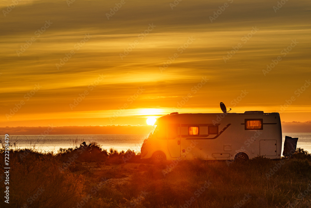 Fototapeta premium Caravan on sea at sunrise.