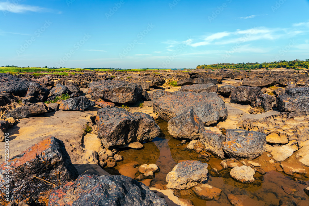 Grand Canyon in Thailand, Nature of rock canyon in Mekong River, Dry rock reef in the Mekong River with mountain hills. View of Sam Phan Bok is called Valley of Thailand. Nature landscape background. Grand Canyon in Thailand, Nature of rock canyon in Mekong River, Dry rock reef in the Mekong River with mountain hills. View of Sam Phan Bok is called Valley of Thailand. Nature landscape background.