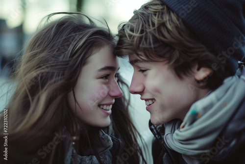 Young teen couple on their first date. Teenage boy and teenage girl celebrating Valentine's Day. Boyfriend and girlfriend spending time together outdoors. First love concept.
