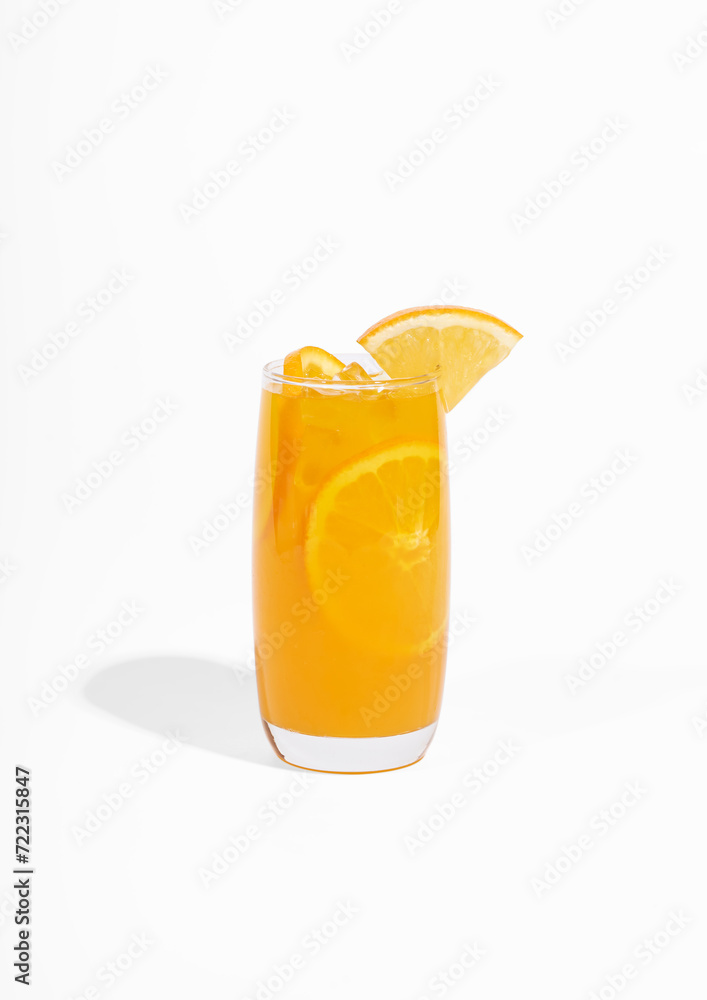 Glass of 100% Orange juice with orange slices fruits isolated on white background. cooling beverage summer drink Glass of 100% Orange juice with orange slices fruits isolated on white background. cooling beverage summer drink