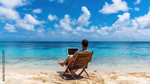 Employee sitting on beach with laptop for remote work © Brian