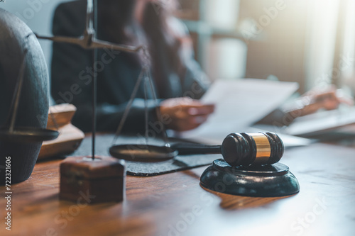 lawyer, judgement, court, judge, justice, law, legal, courtroom, punishment, courthouse. lawyer or judge consulting or discussing contract documents in office to to diagnose lawsuit and judge it. photo