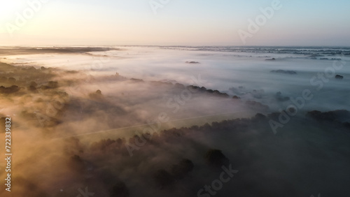 Wallpaper Mural Aerial drone view of meadow landscape in The Netherlands on a sunny, foggy morning. Misty low clouds farmland landscape captured from above. Torontodigital.ca
