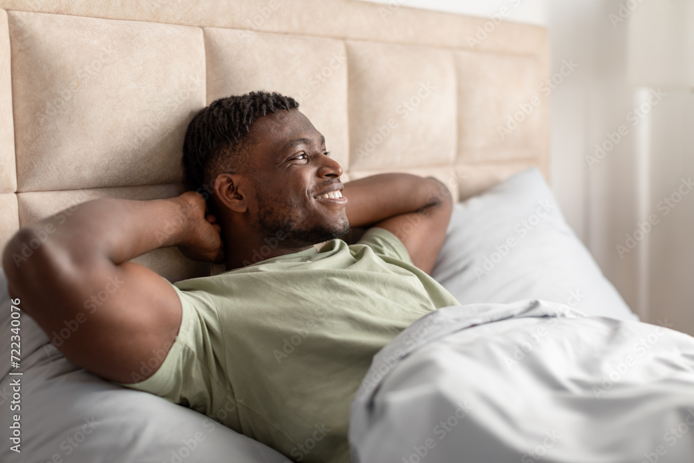 Black Guy Lying Awake Relaxing In Morning In Comfortable Bed Black Guy Lying Awake Relaxing In Morning In Comfortable Bed