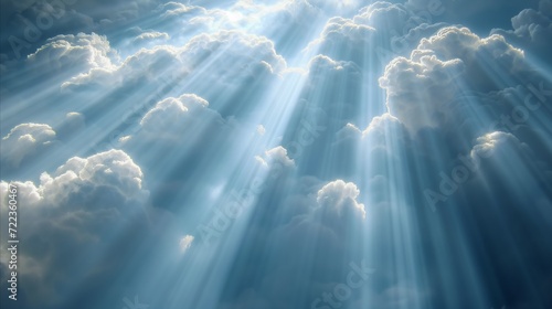 Majestic Sunbeams Piercing Through Clouds on a Tranquil Day photo