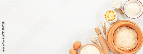 Baking ingredients. dough flour. Cooking ingredients eggs, sugar, butter, milk, rolling pin on white background. Long banner format. top view
