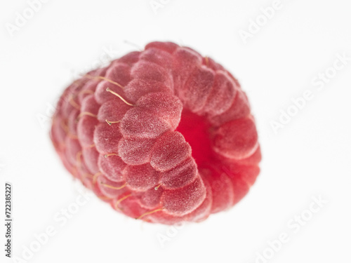 ripe, red raspberry close-up on a white background