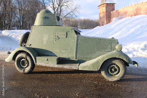 old armored car on the road at winter