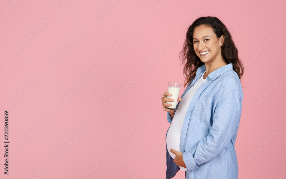 Healthy young pregnant woman holding glass of milk Healthy young pregnant woman holding glass of milk