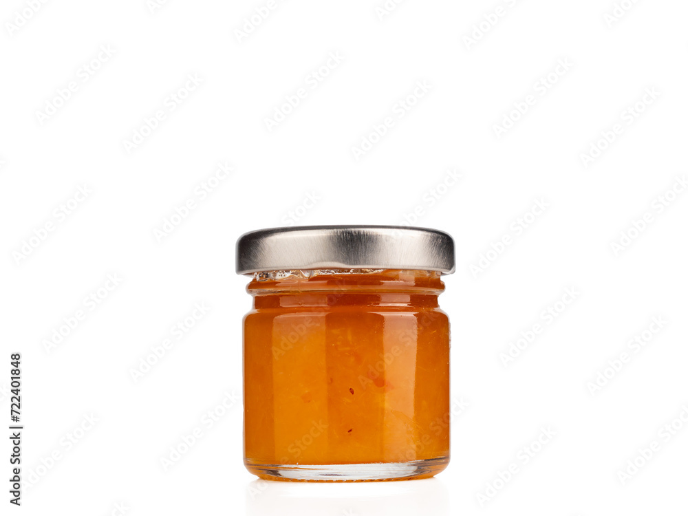 Glass jar with jam. Glass jar with jam close-up on a white background. Glass jar with jam. Glass jar with jam close-up on a white background.