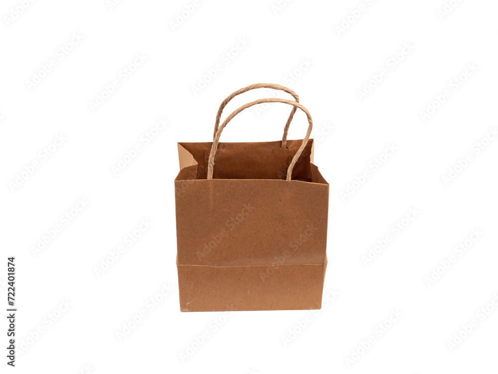 Paper bag on a white background. Paper bag close up. Paper bag on a white background. Paper bag close up.