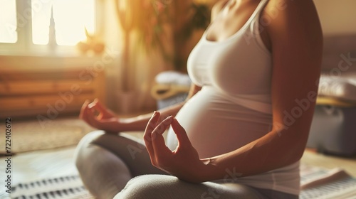 Zen mom: Woman meditating and practicing yoga for a peaceful, healthy pregnancy photo