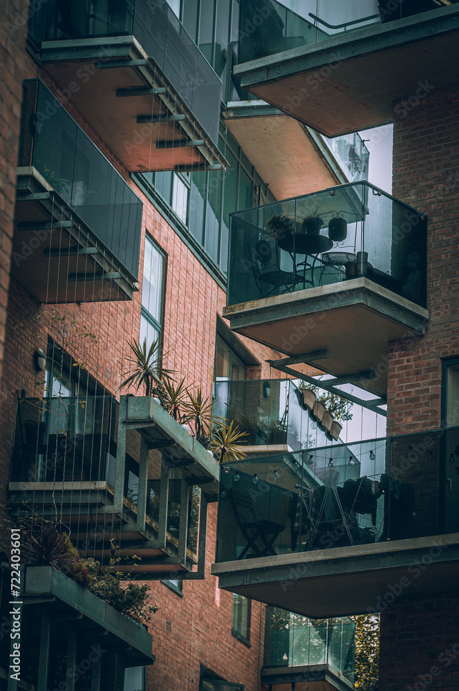 Web of glass and steel balconies in Brighton new brick buildings, East Sussex, England Web of glass and steel balconies in Brighton new brick buildings, East Sussex, England