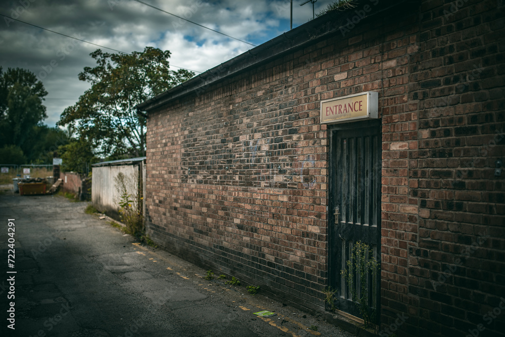 Silgle door in a red brick building looks abandon, Nantwich, Cheshire, UK