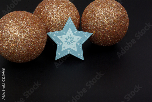 christmas background with brocate baubles and wooden blue star for cars, posters, leaflet photo