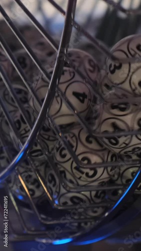 Balls with numbers rotate in a lottery machine