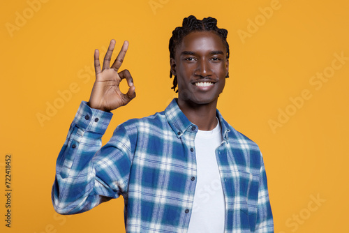Portrait Of Positive Young Black Guy Showing Ok Gesture At Camera