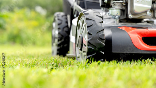 lawn mower on a freshly mowed flat lawn