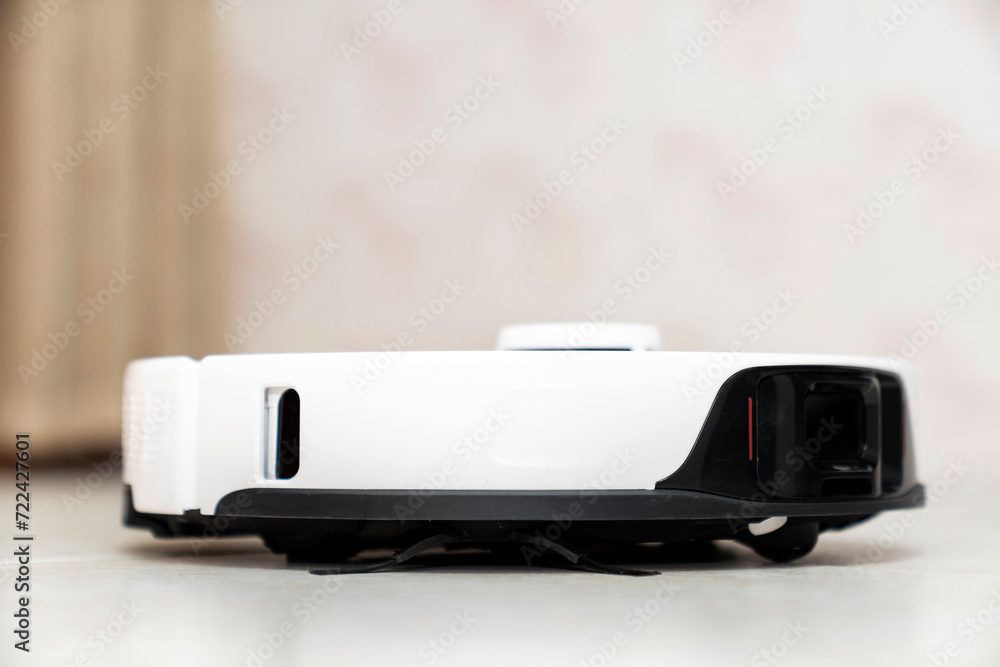 robot vacuum cleaner in modern smart home, robotic vacuum cleaner on tiles floor, Robot vacuum cleaner cleaning dust on tile floors. Modern smart cleaning technology housekeeping. robot vacuum cleaner in modern smart home, robotic vacuum cleaner on tiles floor, Robot vacuum cleaner cleaning dust on tile floors. Modern smart cleaning technology housekeeping.