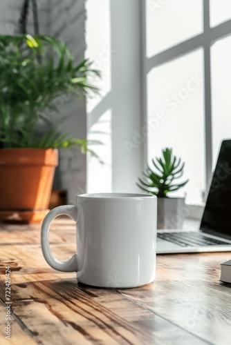 White mug mockup on modern stylish workplace with laptop. Cup mockup.